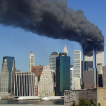 Plumes of smoke billow from the eWorld Trade Center towers in New York City after a Boeing 757 hits each tower during the September 11 attacks