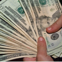 20 dollar bills in someone's hands