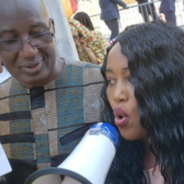 Man and woman, she is talking into a megaphone