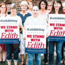 People holding signs that say Solidarity with Edith