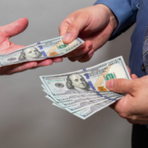 Someone handing someone else money