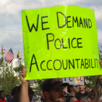 Sign saying We Demand Police Accountability