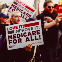 People holding Medicare for all signs