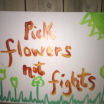 Sign saying Pick Flowers not Fights