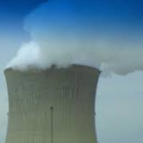Top of nuclear plant with lots of white smoke coming out