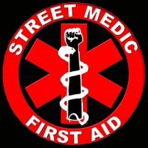 Red circle with star shape in middle with fist and snake, words Street Medic First Aid
