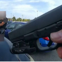 Gun aimed at car