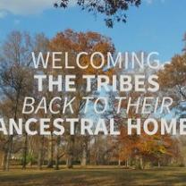Scene of outdoors with trees an d leaves turning yellow and the white words in front: Welcoming the Tribes back to their ancestral home