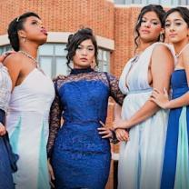 Women posing in gowns