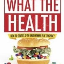 Big hamburger with pills between buns and words What The Health