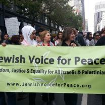 People marching with Jewish Voice for Peace banner