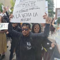 Man holding protest sign