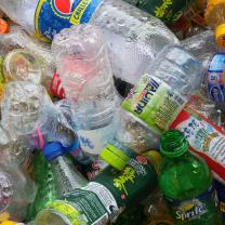 Colorful photo of empty plastic bottles all lying on top of each other in a heap