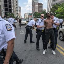 Black man being handcuffed by cops
