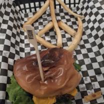 Black bean burger and fries in the shape of a peace sign