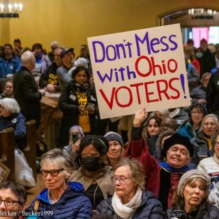 People protesting with sign saying Don't Mess with Ohio Voters