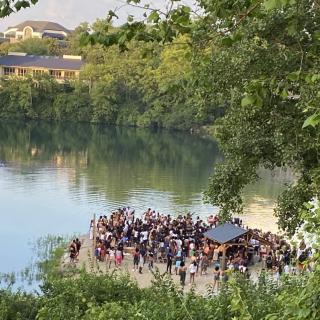 People gathered by a quarry