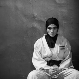 Person sitting in judo outfit