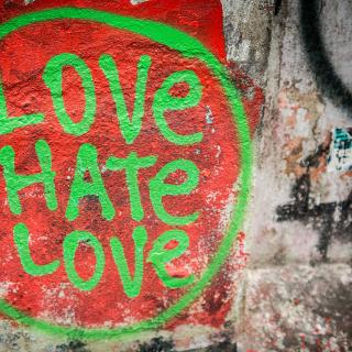 Love Hate Love spray painted on a wall