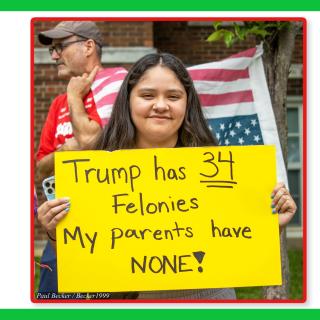 Woman with sign saying Trump has 34 felonies, my parents have NONE