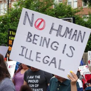 No Human Being is Illegal sign