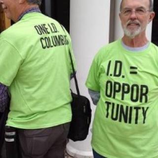 Two men wearing OneID T-shirts