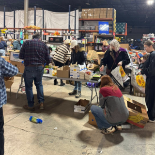 People in a food warehouse packing