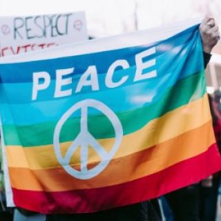 Peace sign on rainbow flag
