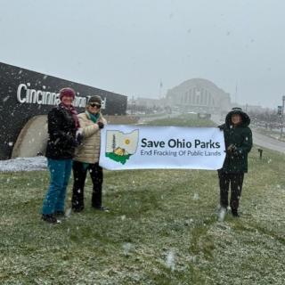 People holding Save Ohio Parks banner