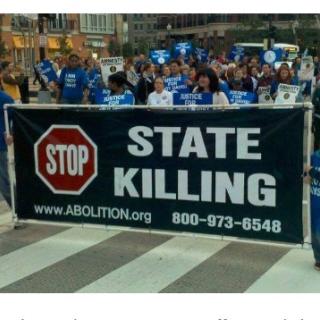 People marching with sign Stop State Killing