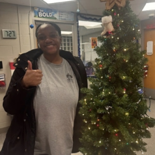 Woman by a Xmas tree