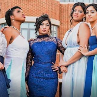 Women posing in gowns