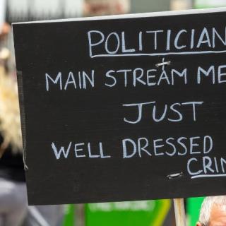 Sign saying Politicians, mainstream media, just well dressed criminals