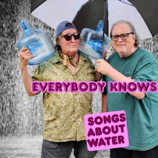 Bob and Dan with an umbrella and water bottles