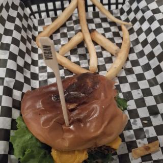 Black bean burger and fries in the shape of a peace sign